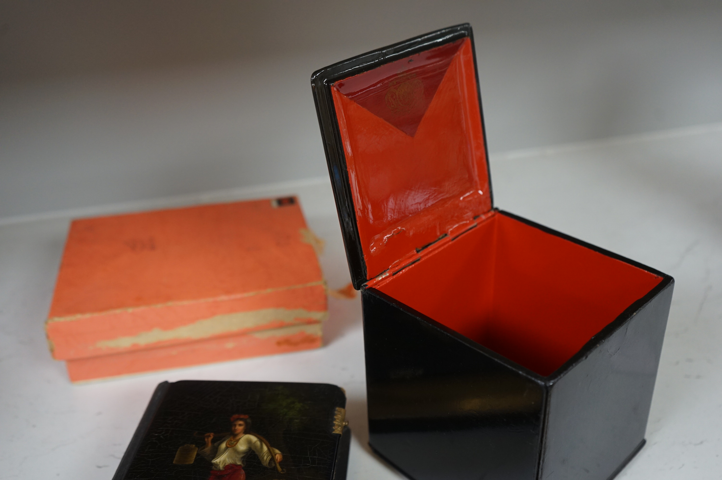 A late 19th / early 20th century Russian lacquer tea caddy and photograph album, largest 16cm high. Condition - fair/good